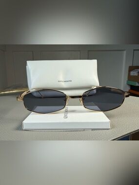 GENTLE MONSTER Gold Frame Sunglasses with Dark Gray Lenses